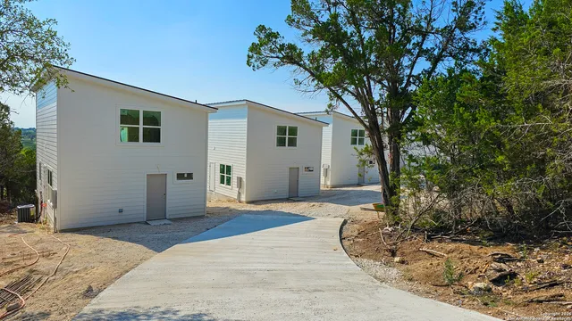 a view of a house with a tree