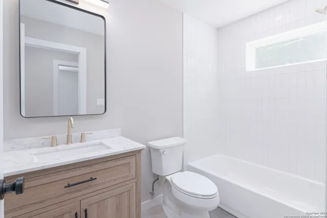 an entryway with a white walls