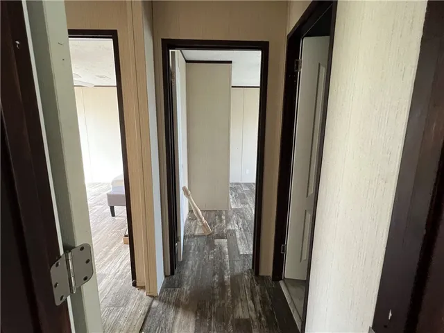 a view of a bathroom from a glass door