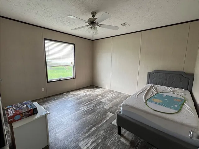 a bedroom with furniture and a window