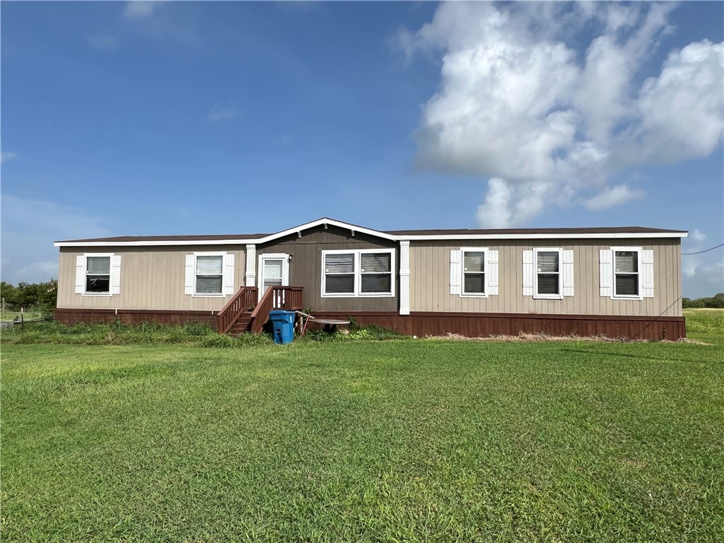 1903 1st Street Bayside, TX 78340 - Photo 3 of 38 a view of a yard in front of a house