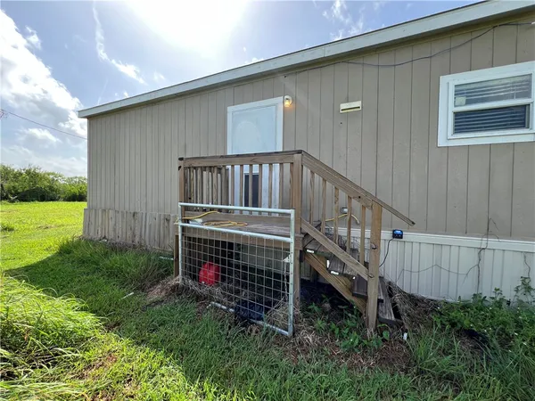 a view of backyard with deck and deck