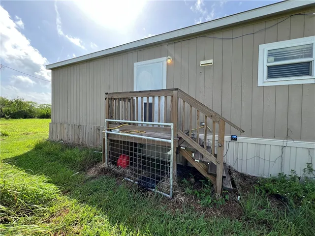 a view of backyard with deck and deck