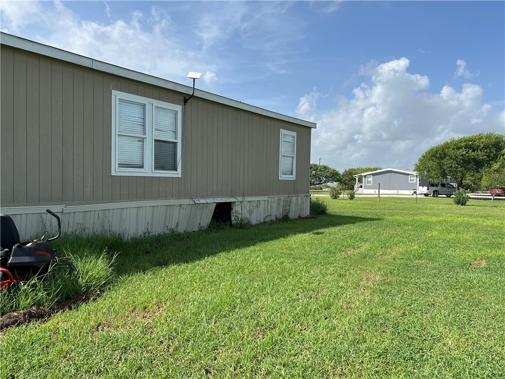 1903 1st Street Bayside, TX 78340 - Photo 10 of 38 a backyard of a house with lots of green space