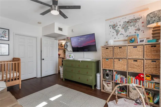 a bathroom with a shower sink vanity mirror and toilet