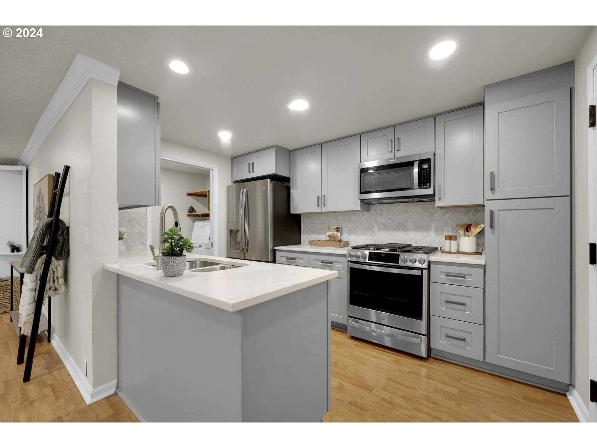100 Westbrook Way Eugene, OR 97405 - Photo 12 of 48 a kitchen with kitchen island a sink stainless steel appliances and cabinets