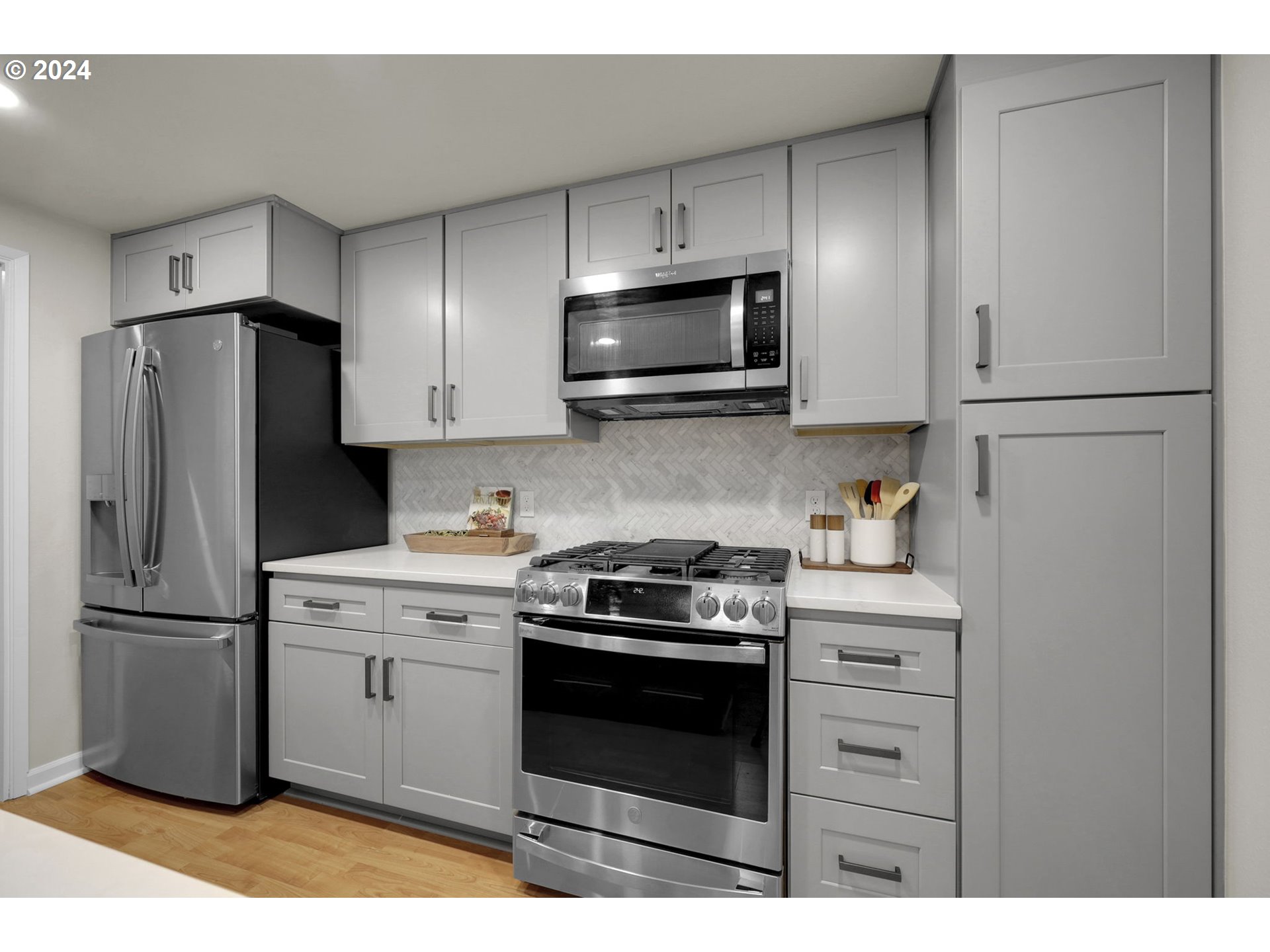 100 Westbrook Way Eugene, OR 97405 - Photo 15 of 48 a kitchen with a stove microwave and refrigerator