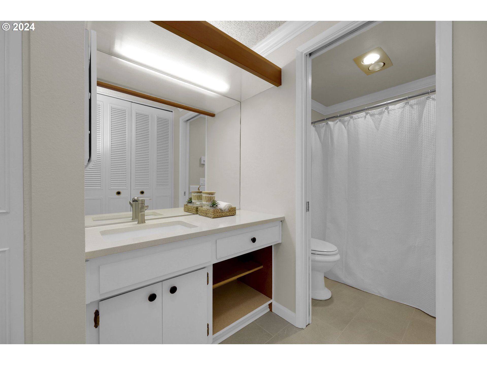 100 Westbrook Way Eugene, OR 97405 - Photo 34 of 48 a bathroom with a sink a toilet and mirror