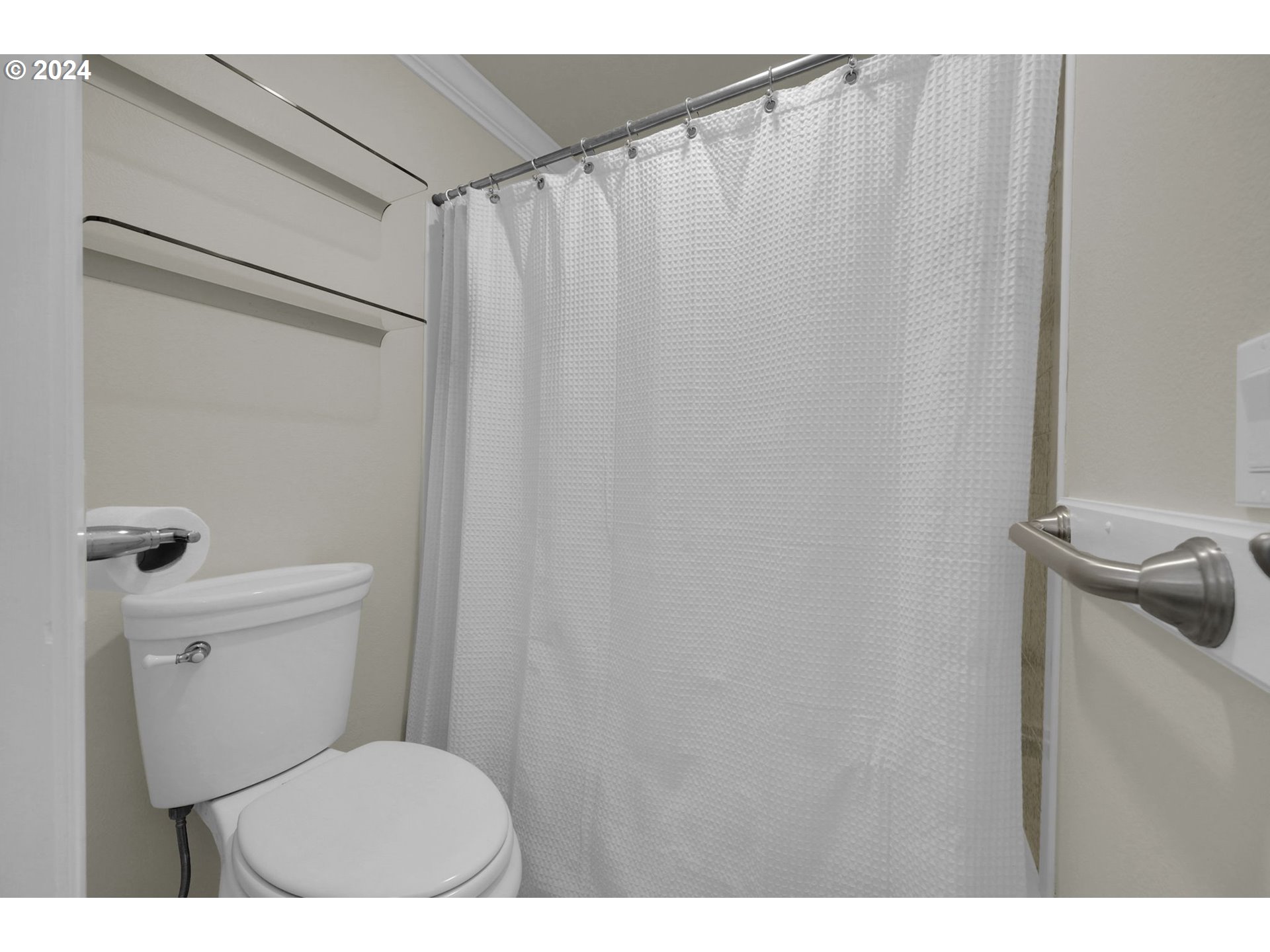 100 Westbrook Way Eugene, OR 97405 - Photo 36 of 48 a bathroom with a toilet and a shower curtain