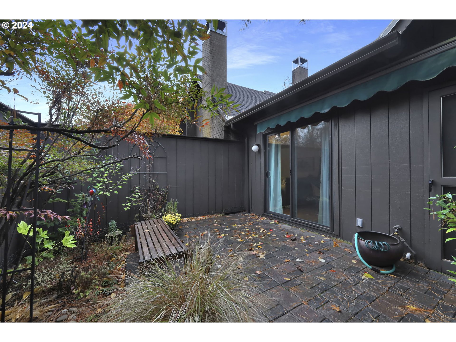 100 Westbrook Way Eugene, OR 97405 - Photo 40 of 48 a backyard of a house with table and chairs