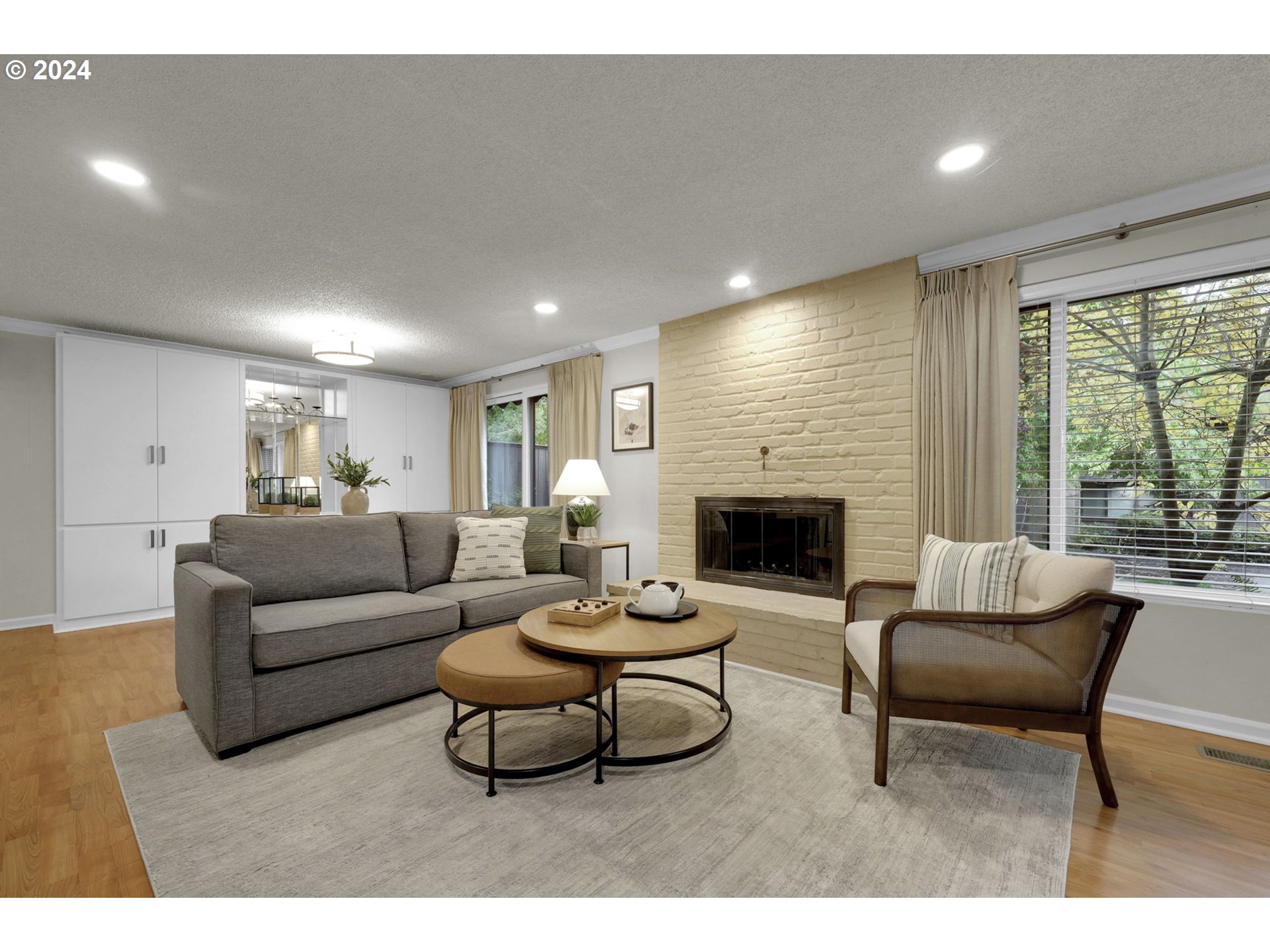 100 Westbrook Way Eugene, OR 97405 - Photo 6 of 48 a living room with furniture and a fireplace