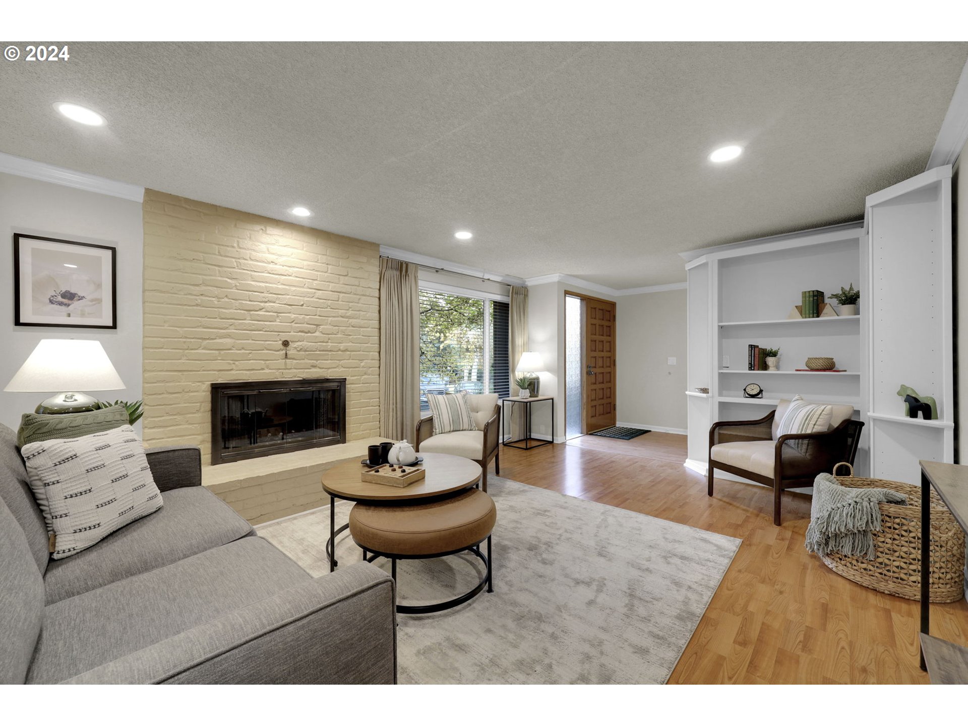 100 Westbrook Way Eugene, OR 97405 - Photo 7 of 48 a living room with furniture a fireplace and a flat screen tv