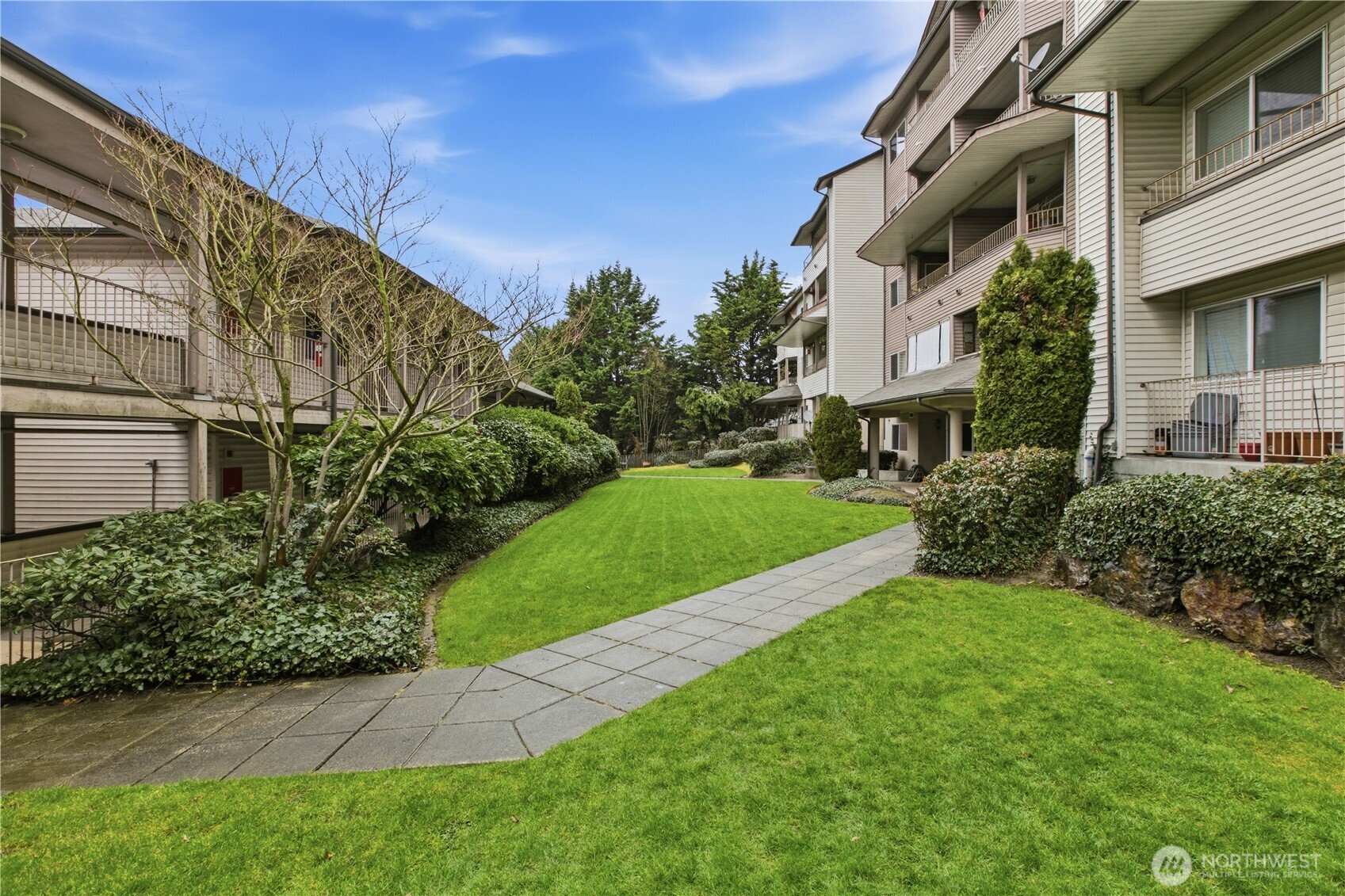 15310 Macadam Road South, Unit A204 Tukwila, WA 98188 - Photo 1 of 25 a view of a house with a yard