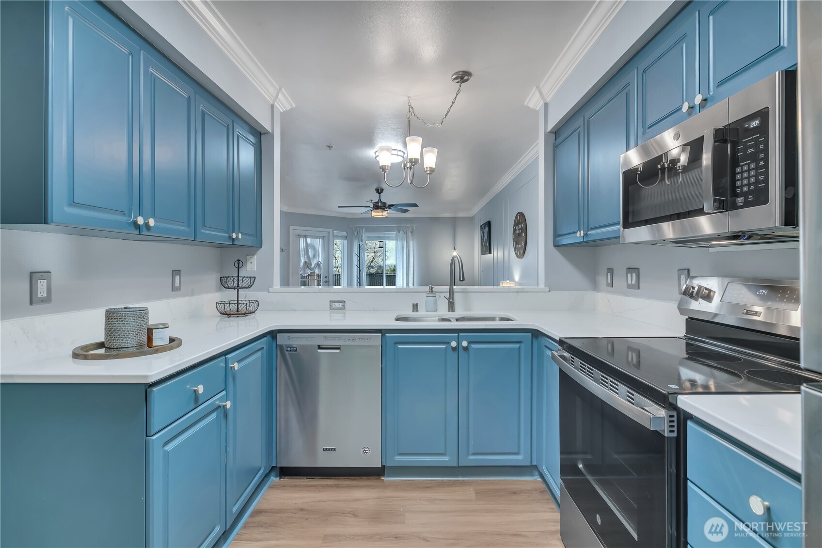 15310 Macadam Road South, Unit A204 Tukwila, WA 98188 - Photo 11 of 25 a kitchen with a sink stove and microwave