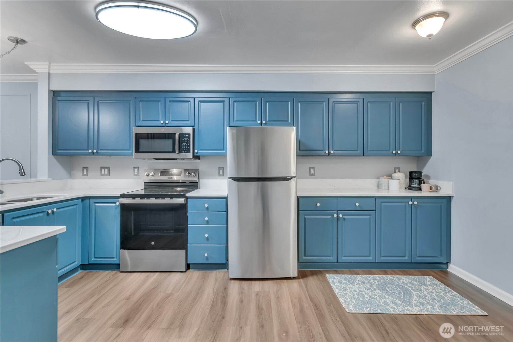 15310 Macadam Road South, Unit A204 Tukwila, WA 98188 - Photo 12 of 25 a kitchen with a refrigerator sink and cabinets