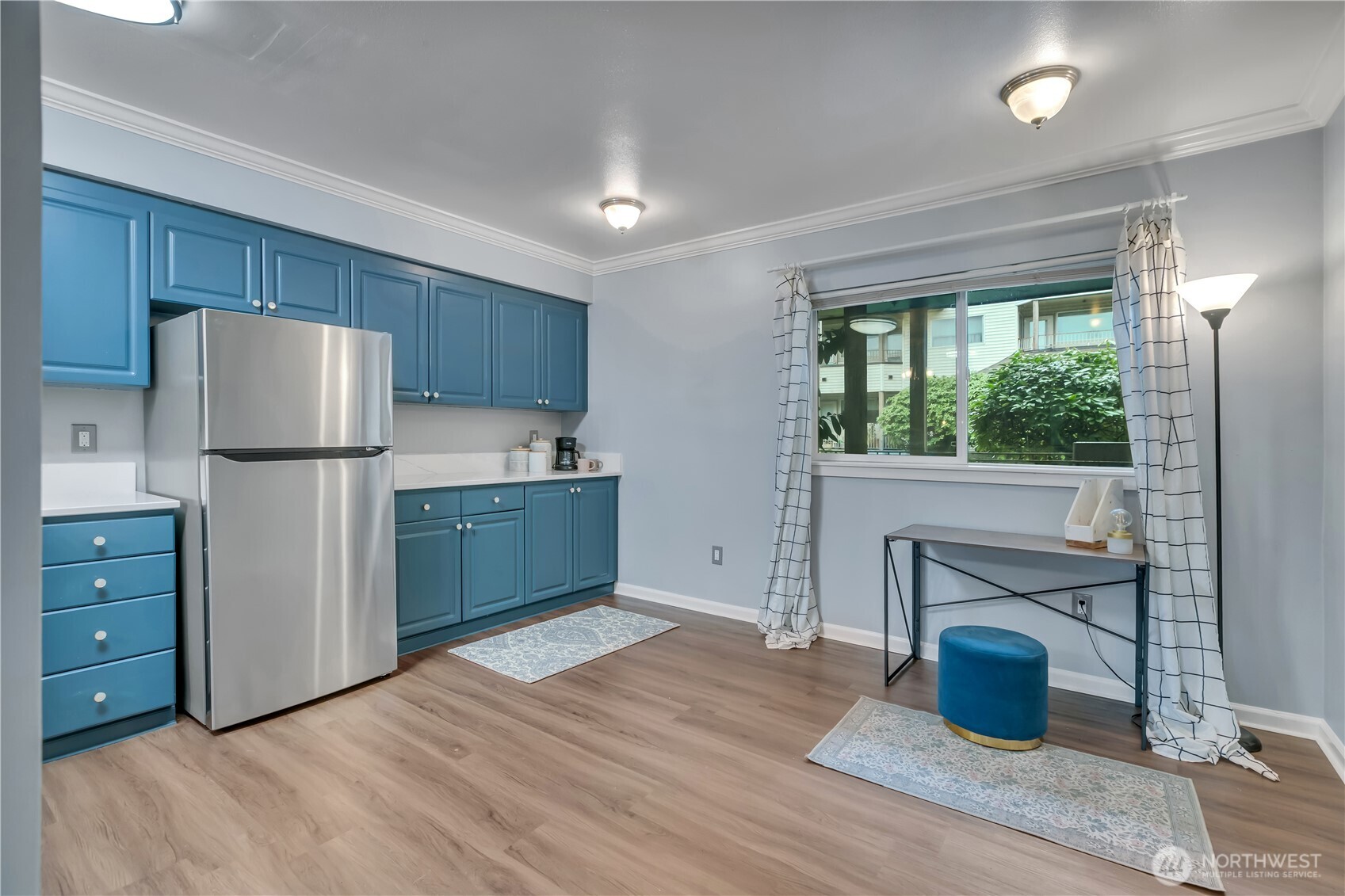 15310 Macadam Road South, Unit A204 Tukwila, WA 98188 - Photo 13 of 25 a kitchen with a refrigerator and a more cabinets
