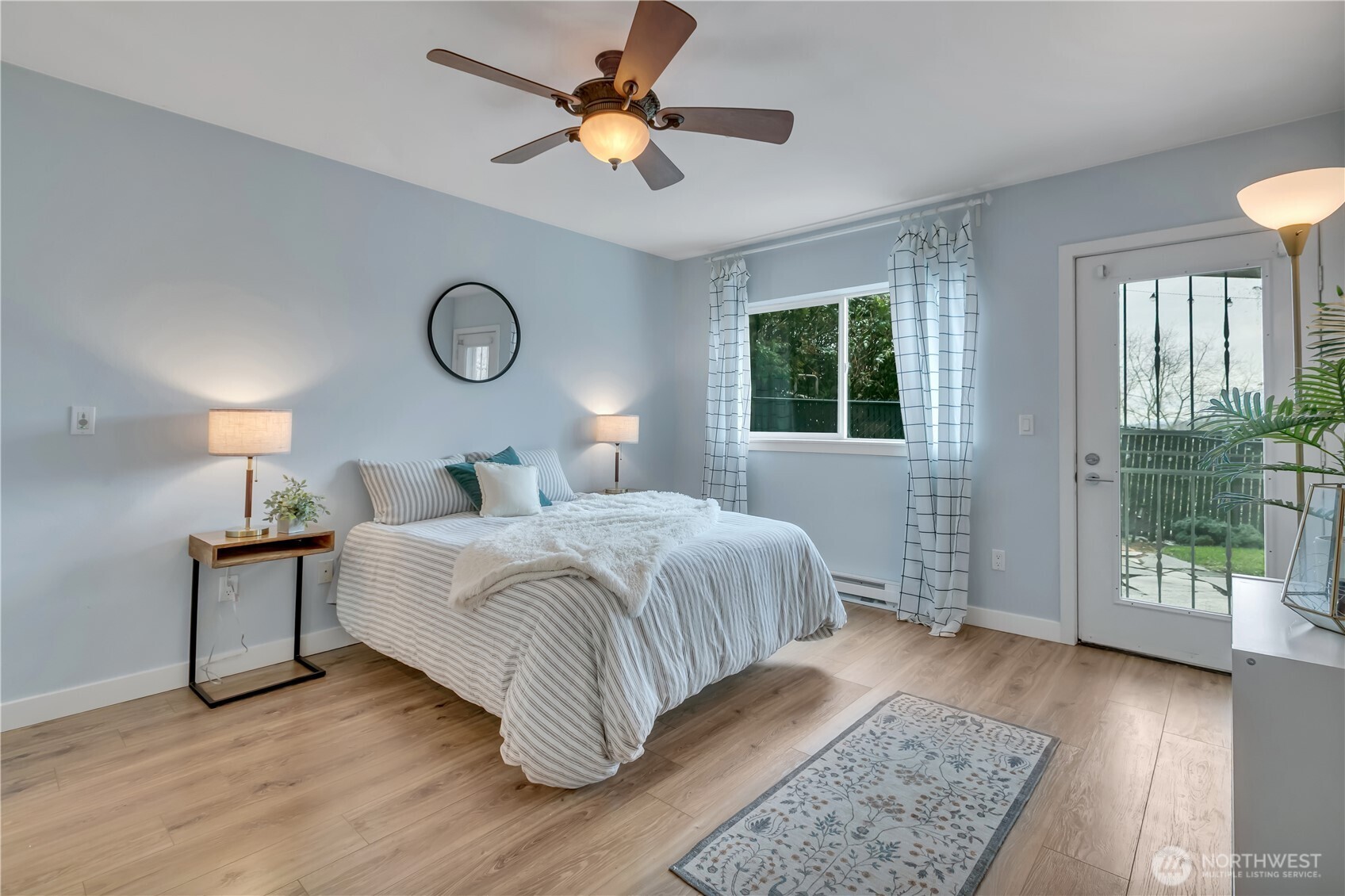 15310 Macadam Road South, Unit A204 Tukwila, WA 98188 - Photo 15 of 25 a bedroom with a large bed and a window