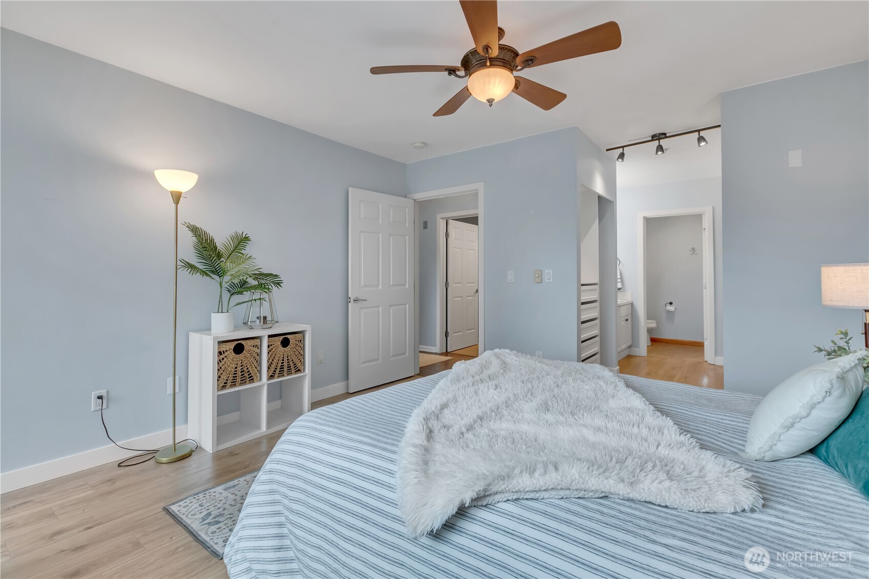 15310 Macadam Road South, Unit A204 Tukwila, WA 98188 - Photo 16 of 25 a bedroom with a bed and a chandelier