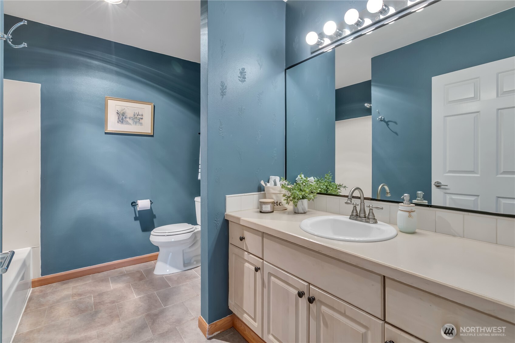 15310 Macadam Road South, Unit A204 Tukwila, WA 98188 - Photo 21 of 25 a bathroom with a sink a toilet and a mirror