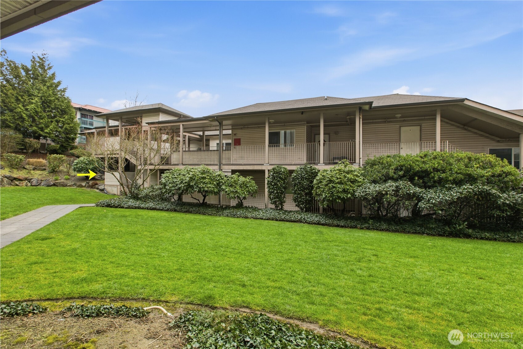 15310 Macadam Road South, Unit A204 Tukwila, WA 98188 - Photo 22 of 25 a front view of a house with a yard
