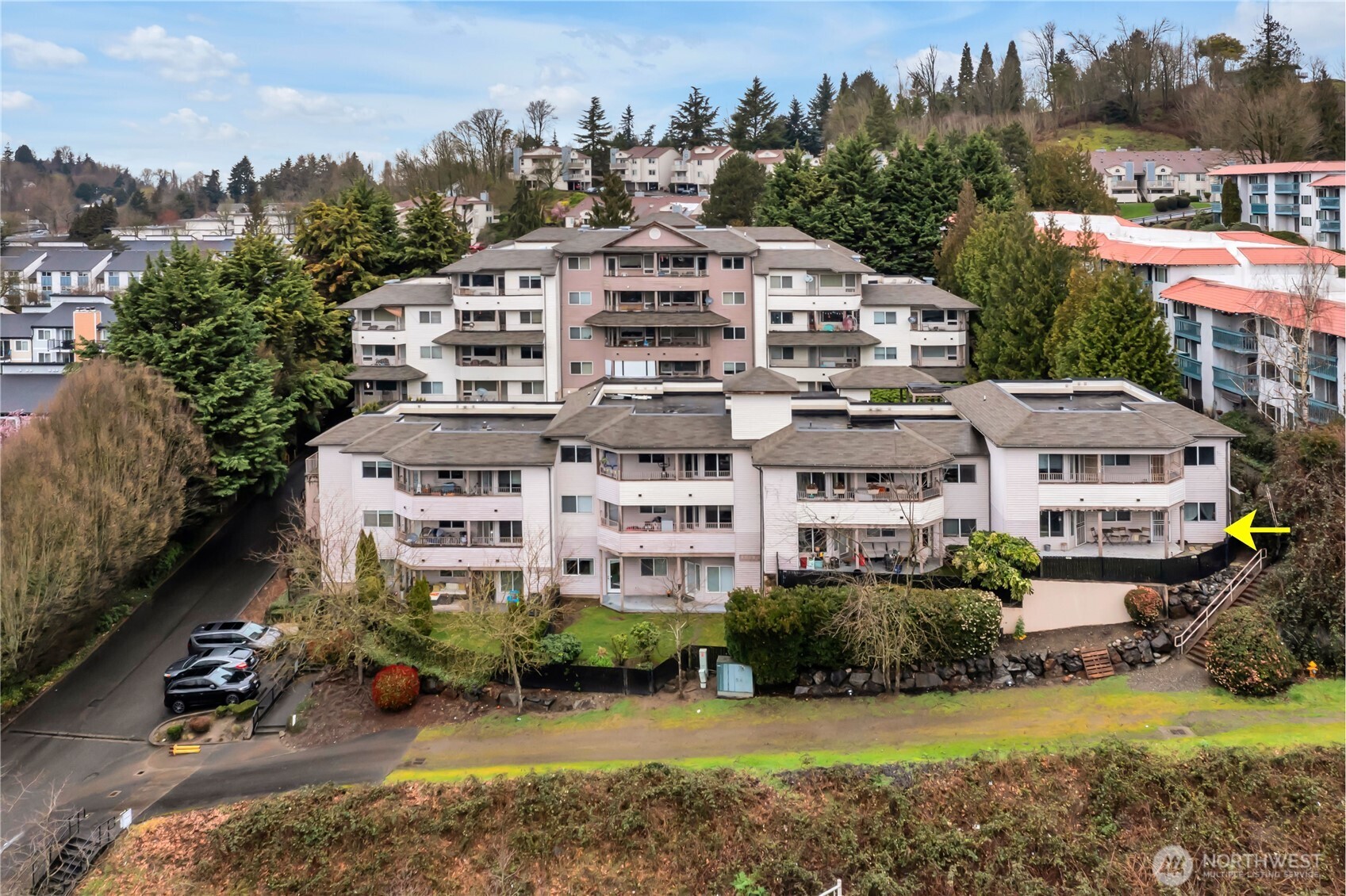 15310 Macadam Road South, Unit A204 Tukwila, WA 98188 - Photo 24 of 25 a view of a big house with a big yard and large trees