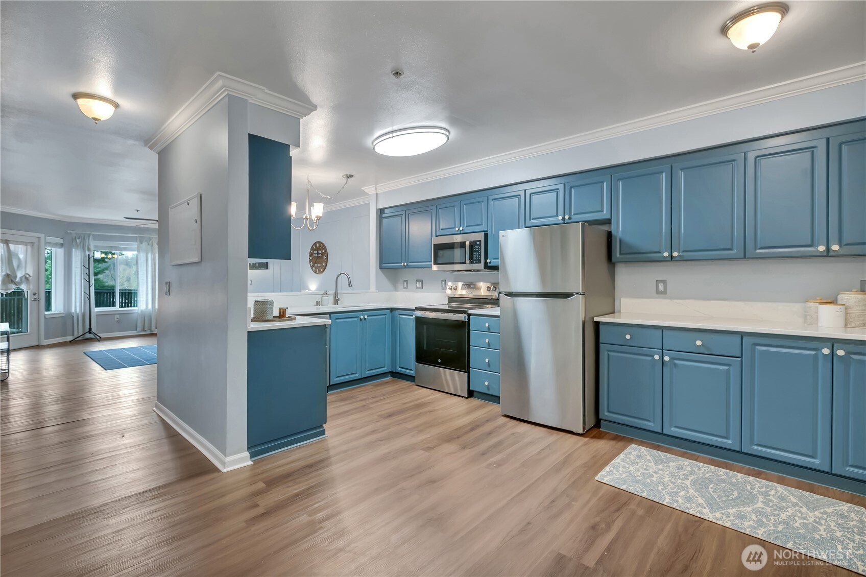 15310 Macadam Road South, Unit A204 Tukwila, WA 98188 - Photo 10 of 25 a kitchen with a refrigerator a sink and cabinets