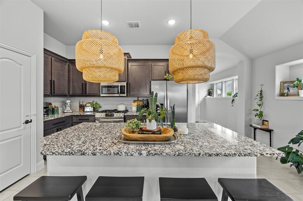 1084 Imperial Eagle Road Alvarado, TX 76009 - Photo 11 of 39 a kitchen with a table and chairs in it