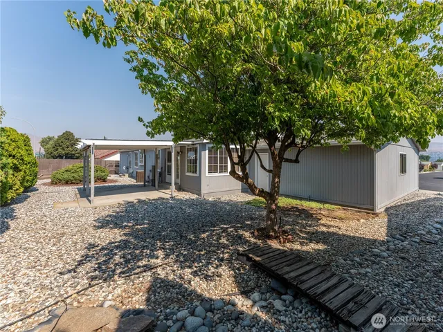 a backyard of a house with lots of green space