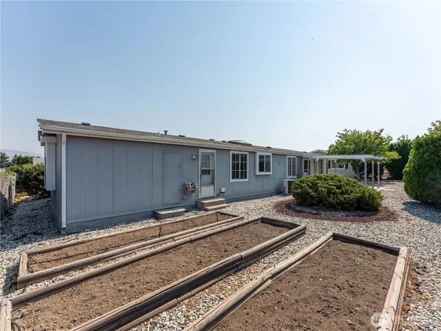 a front view of a house with a large window