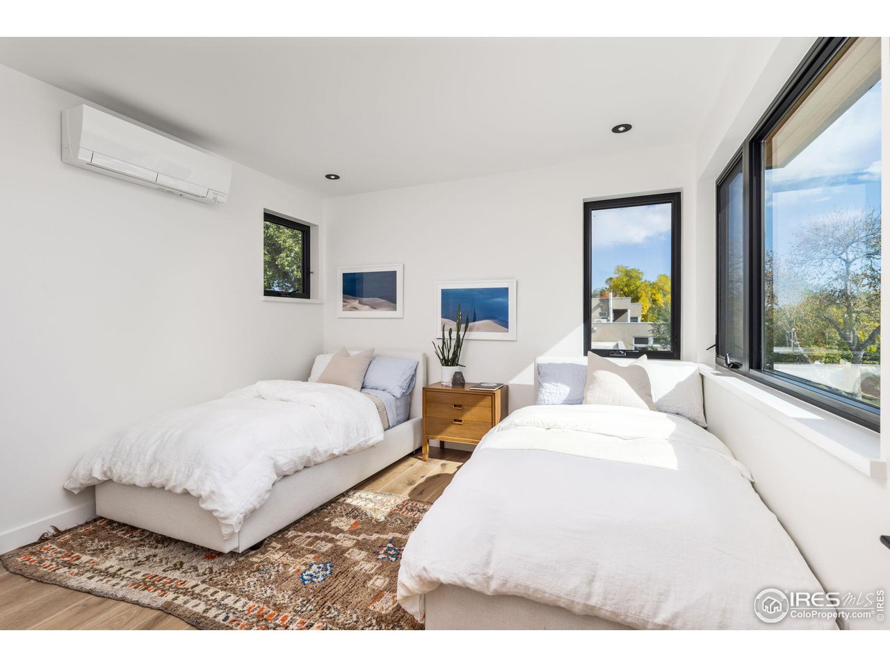 2125 Upland Avenue Boulder, CO 80304 - Photo 16 of 38 a bedroom with a bed and a large window