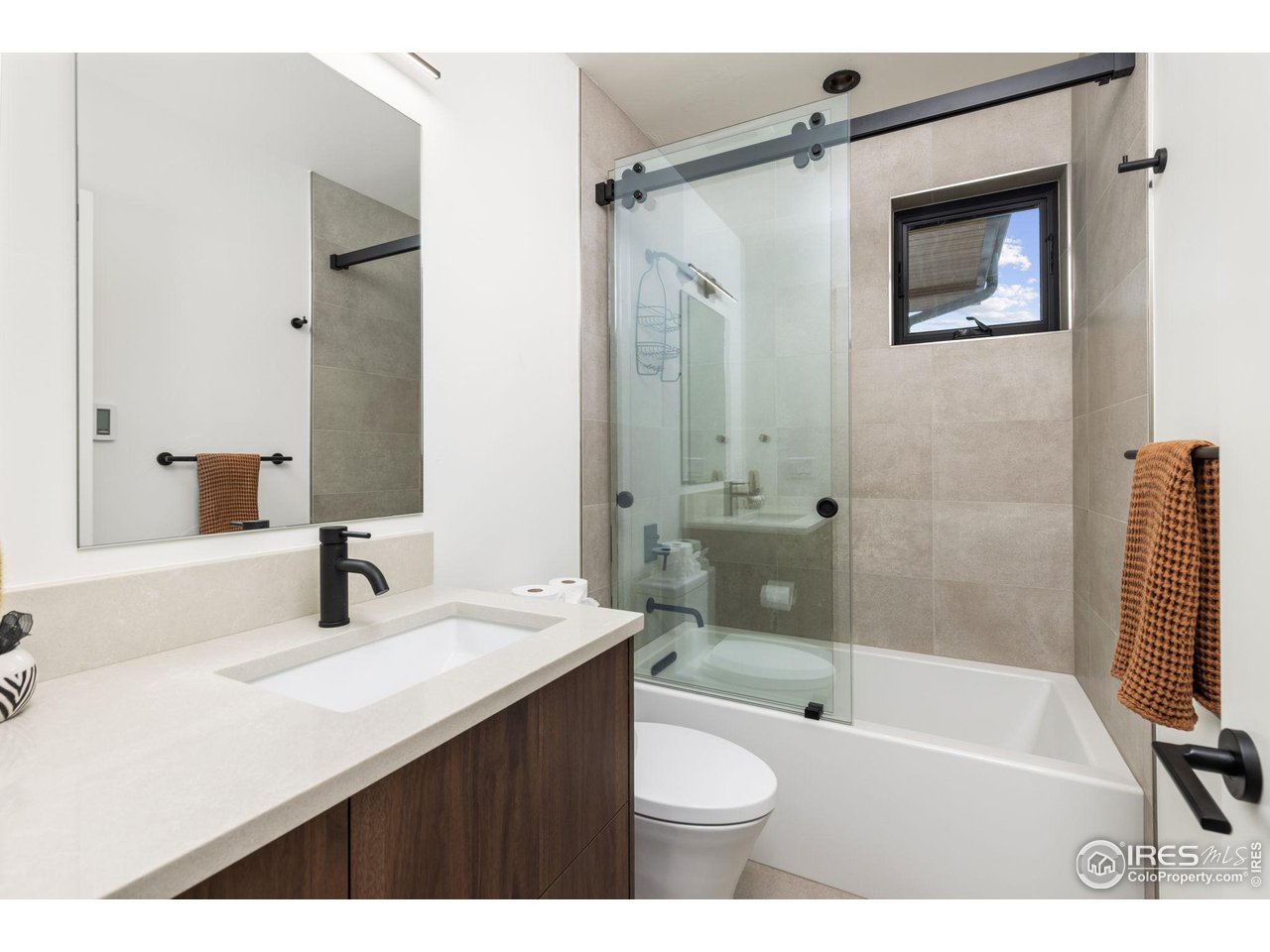 2125 Upland Avenue Boulder, CO 80304 - Photo 17 of 38 a bathroom with a sink a toilet and shower