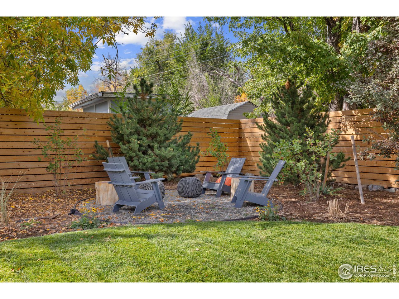 2125 Upland Avenue Boulder, CO 80304 - Photo 24 of 38 a backyard of a house with table and chairs