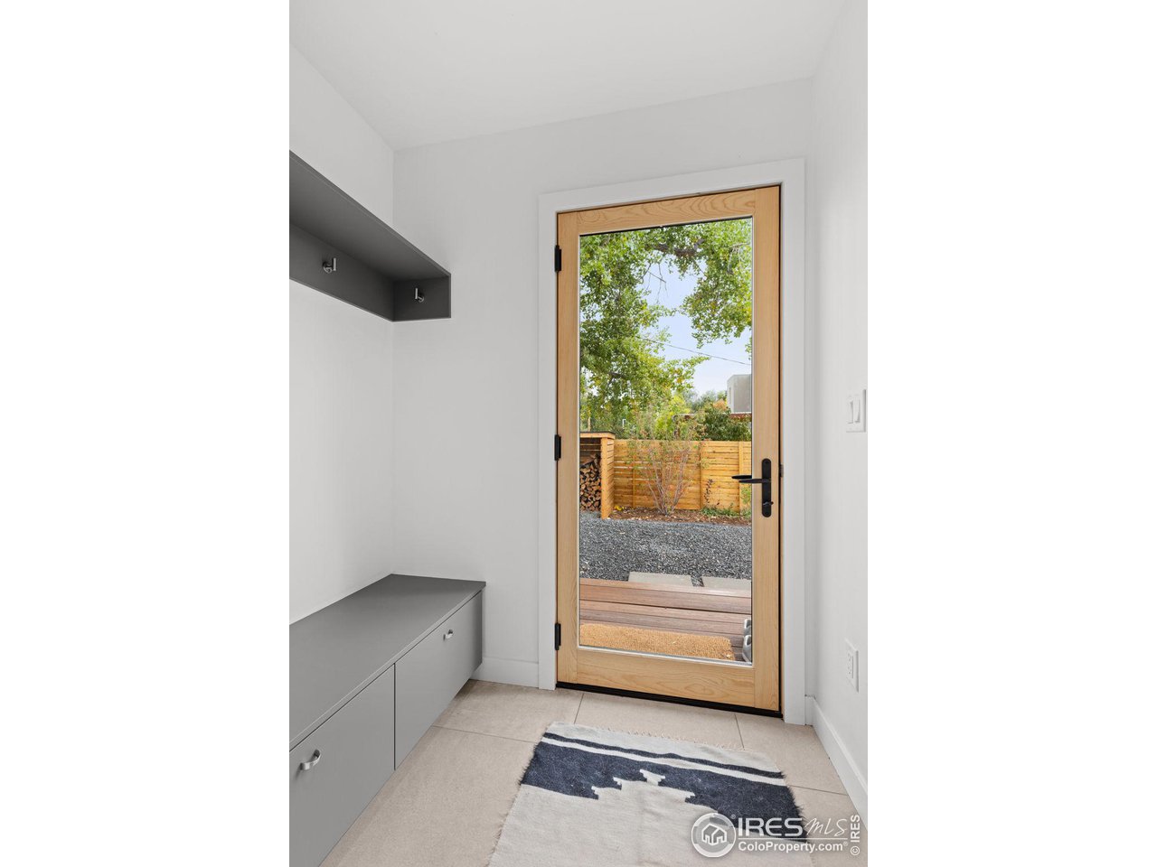 2125 Upland Avenue Boulder, CO 80304 - Photo 26 of 38 a room with a door and a view of hallway