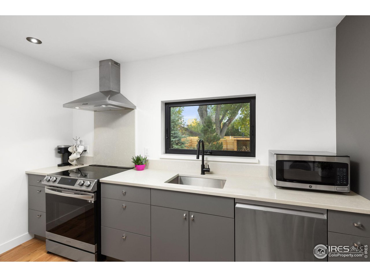2125 Upland Avenue Boulder, CO 80304 - Photo 28 of 38 a kitchen with stainless steel appliances a stove microwave and refrigerator