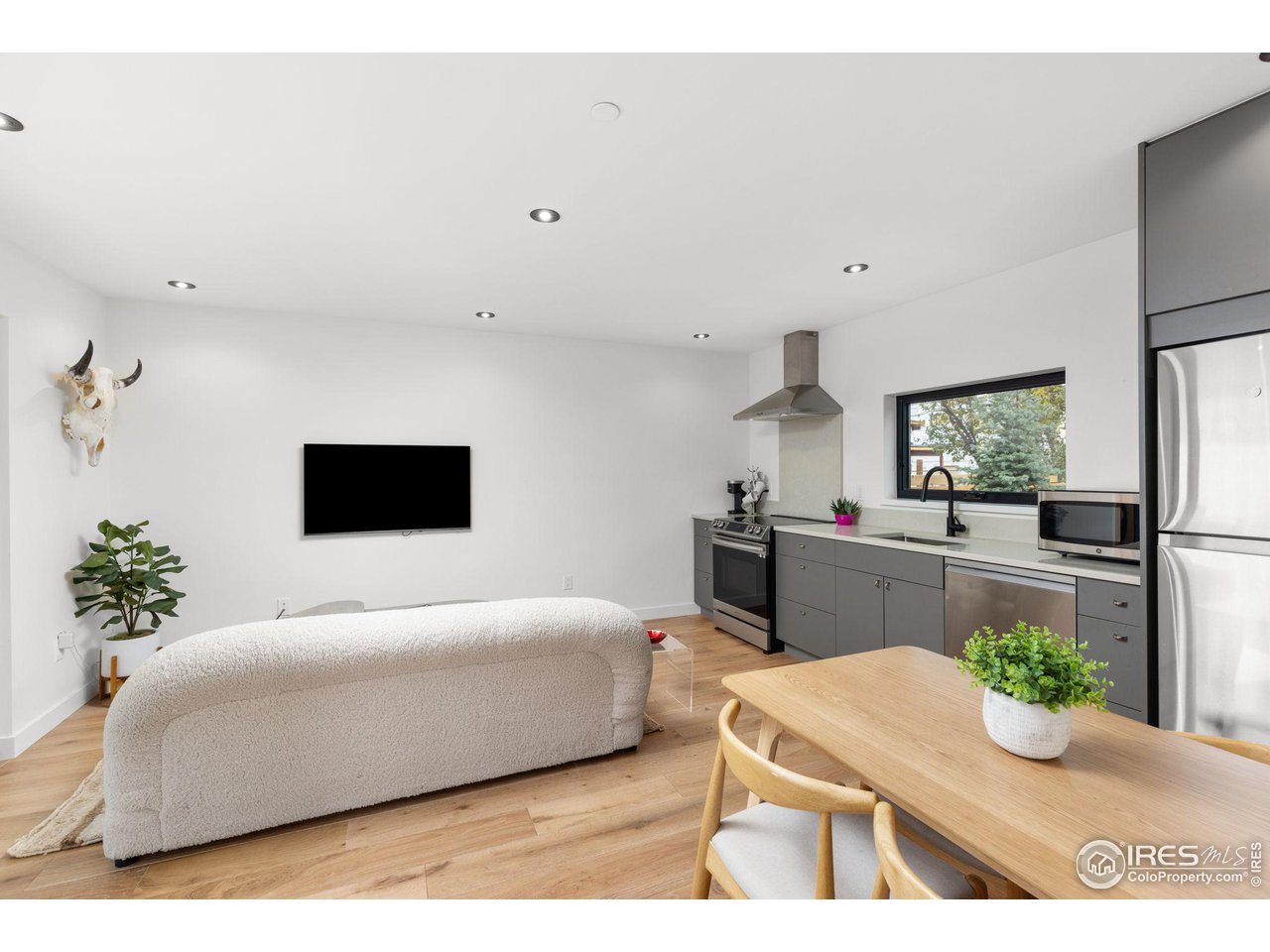 2125 Upland Avenue Boulder, CO 80304 - Photo 29 of 38 a living room with furniture and a flat screen tv