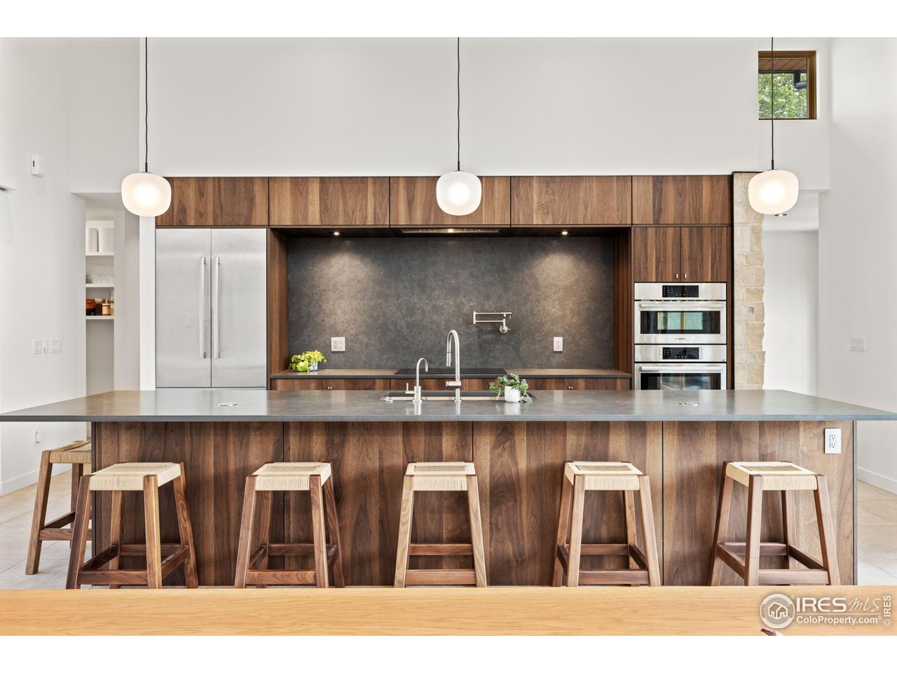 2125 Upland Avenue Boulder, CO 80304 - Photo 3 of 38 a kitchen with a table chairs refrigerator and cabinets