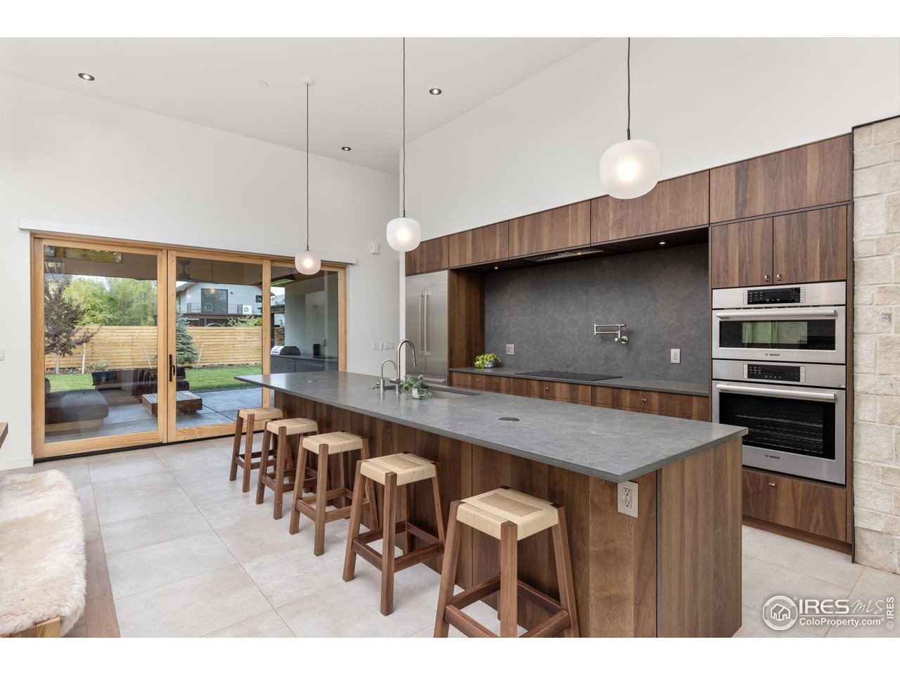 2125 Upland Avenue Boulder, CO 80304 - Photo 6 of 38 a kitchen with a table a sink and chairs