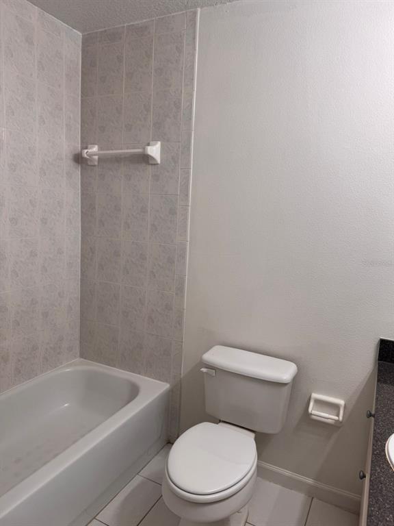 1132 South Pine Ridge Circle, Unit 32 Sanford, FL 32773 - Photo 17 of 26 a white toilet and tub