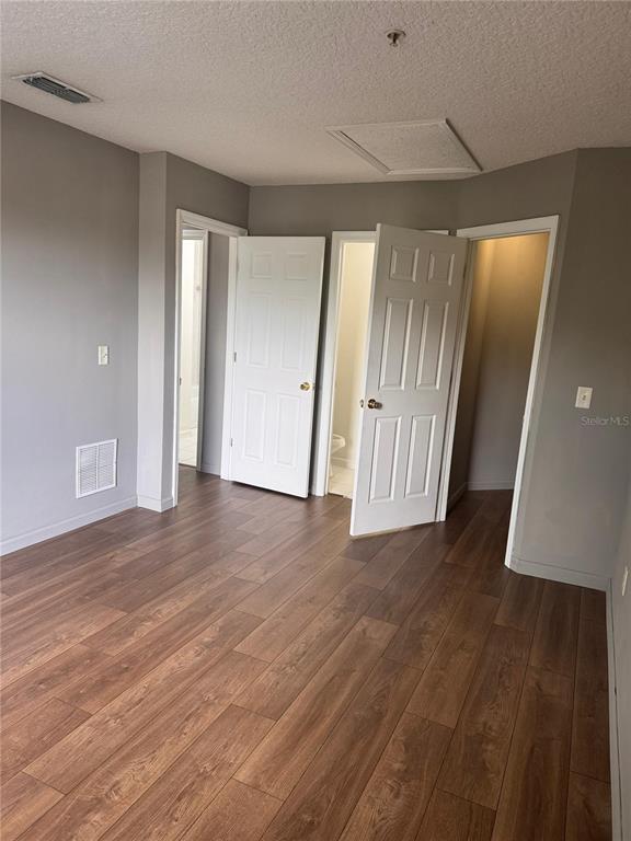 1132 South Pine Ridge Circle, Unit 32 Sanford, FL 32773 - Photo 20 of 26 a view of a hallway with wooden floor