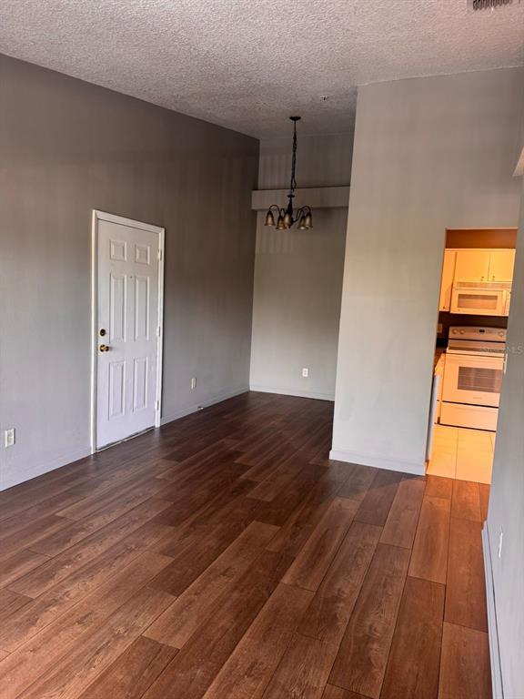 1132 South Pine Ridge Circle, Unit 32 Sanford, FL 32773 - Photo 2 of 26 wooden floor in an empty room