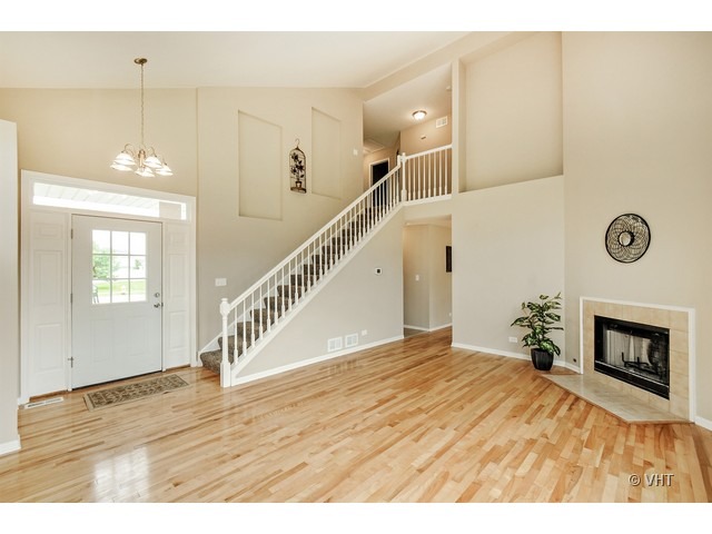115 Moonlight Road Matteson, IL 60443 - Photo 2 of 10 a view of an empty room and wooden floor