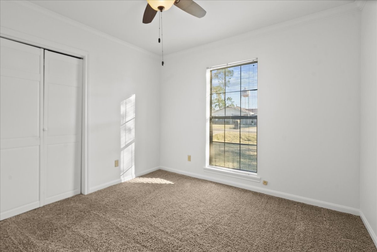105 Alice Street Anahuac, TX 77514 - Photo 21 of 39 a view of an empty room with a window