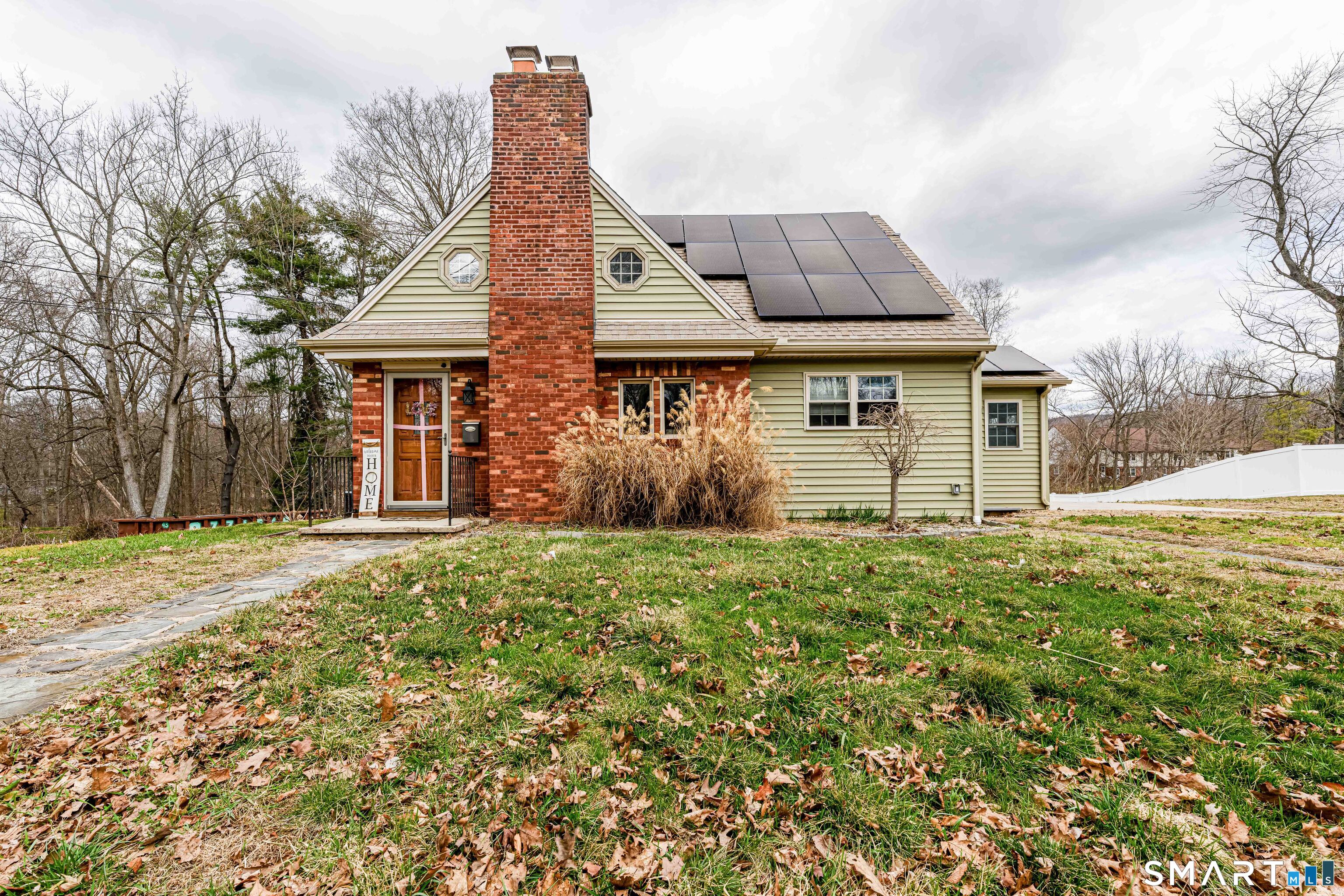 front view of a house with a yard