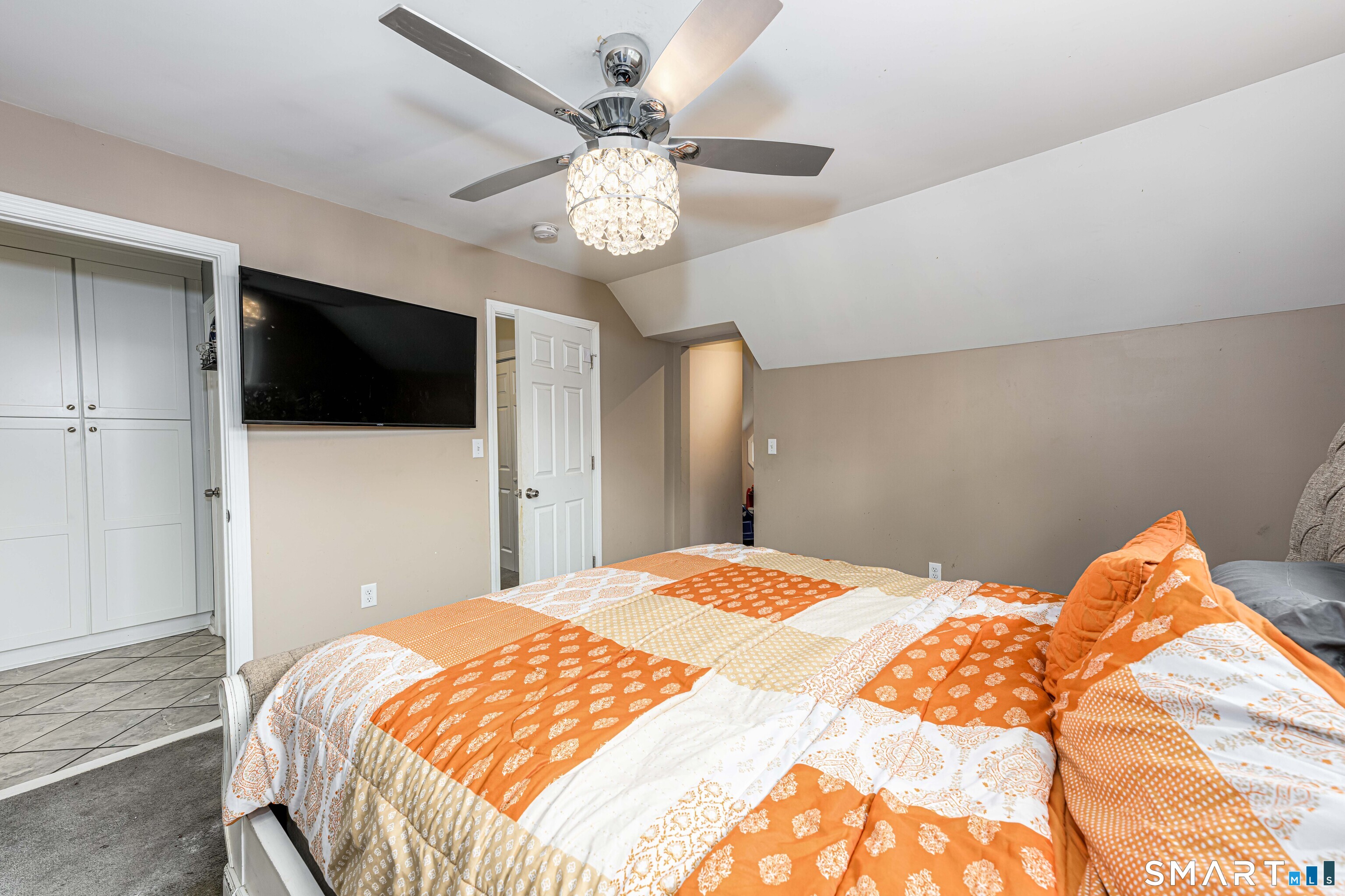 112 Orchard Street Meriden, CT 06450 - Photo 14 of 30 a bedroom with a bed and a flat screen tv