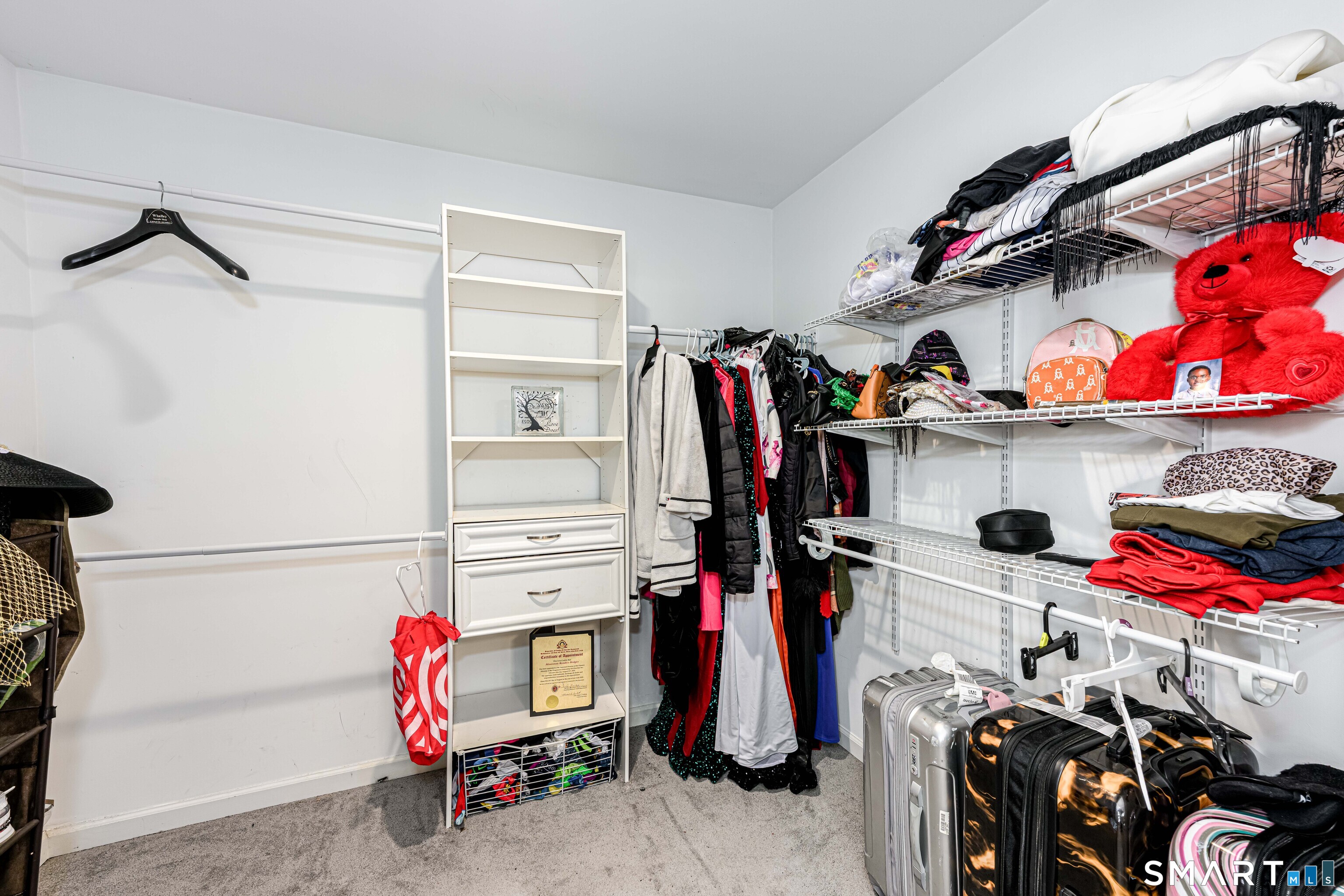 112 Orchard Street Meriden, CT 06450 - Photo 16 of 30 a view of walk in closet with clothes and shoes