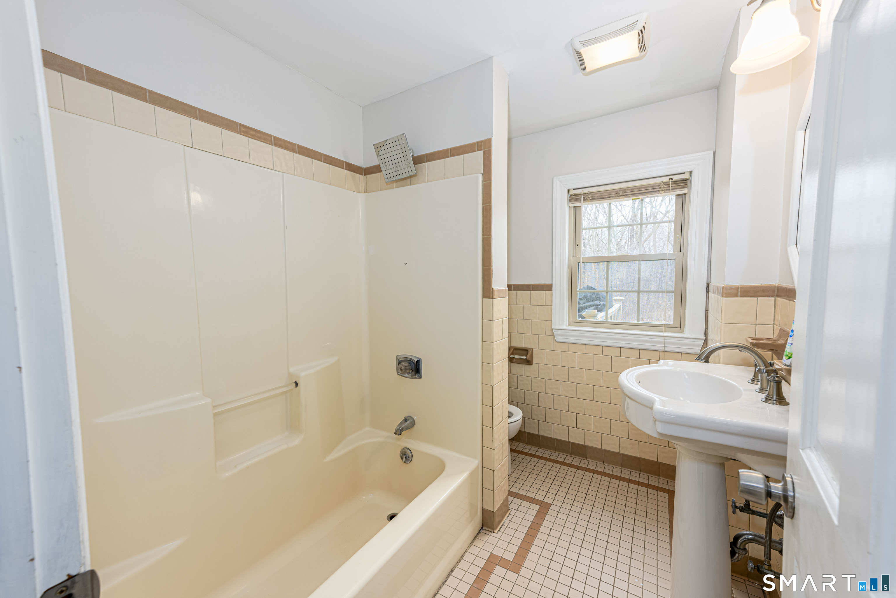 112 Orchard Street Meriden, CT 06450 - Photo 20 of 30 a bathroom with a tub sink and mirror