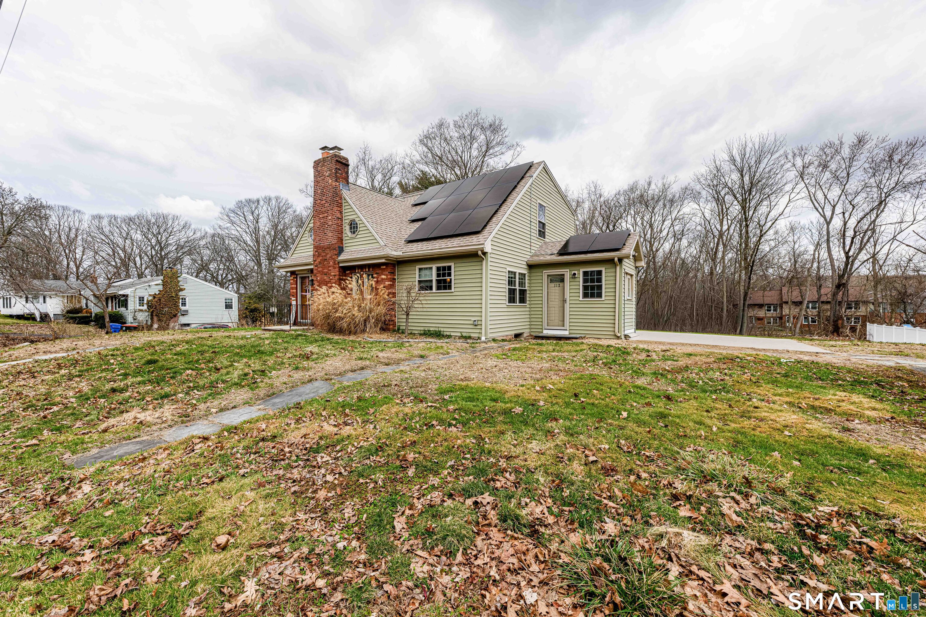 112 Orchard Street Meriden, CT 06450 - Photo 2 of 30 a front view of a house with a yard