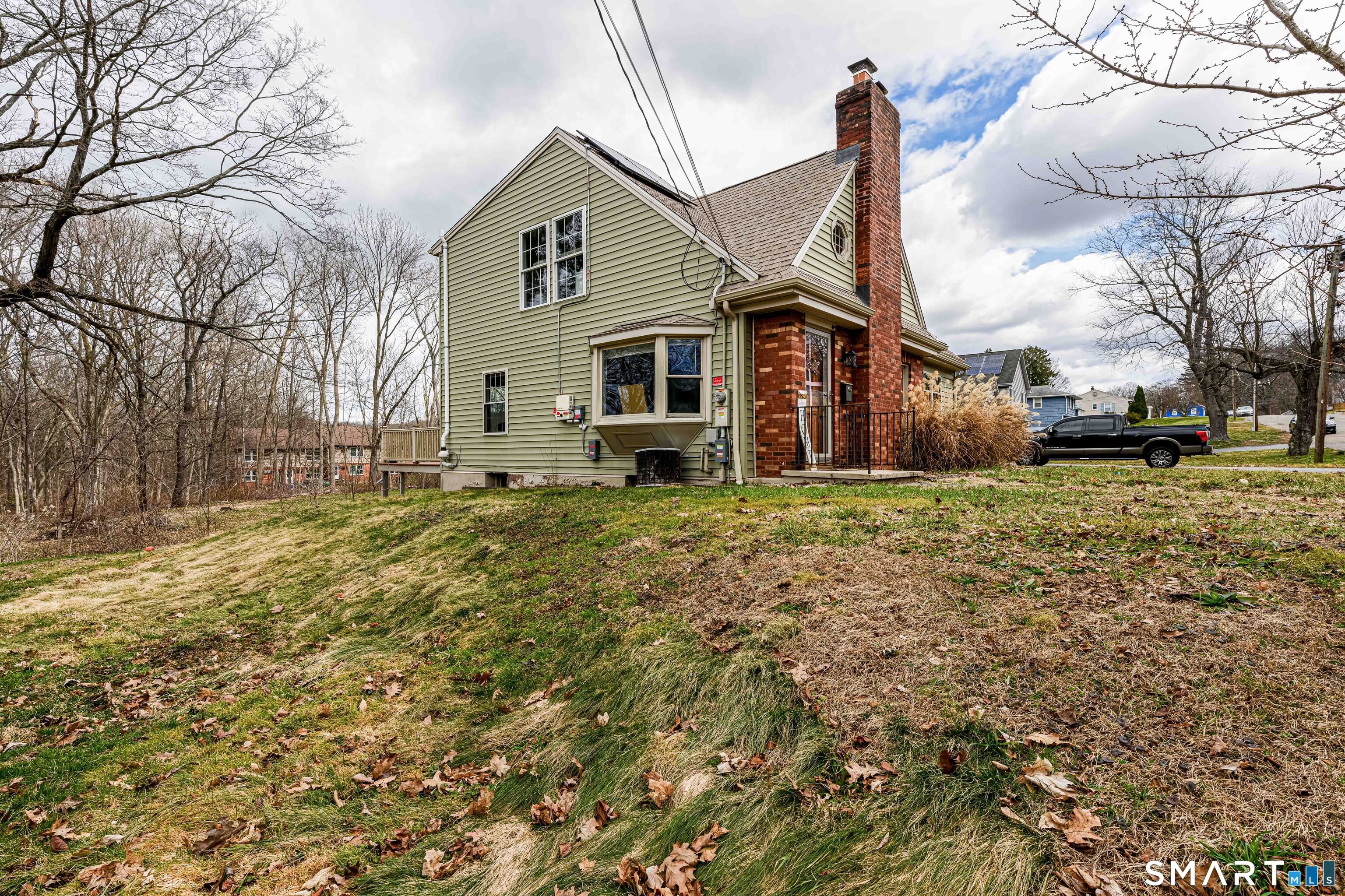 112 Orchard Street Meriden, CT 06450 - Photo 3 of 30 a front view of a house with a yard