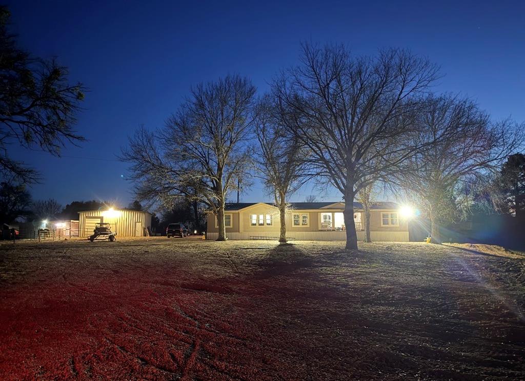 Front of House w/ Bright Evening Lighting.