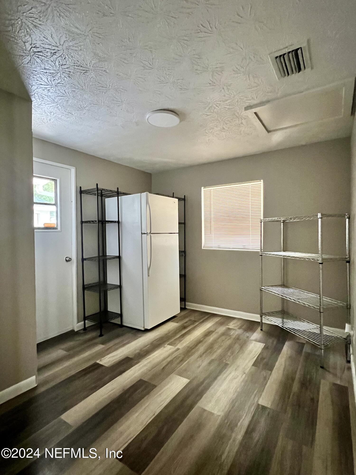 10892 Player Road Jacksonville, FL 32218 - Photo 18 of 37 a view of a livingroom with wooden floor